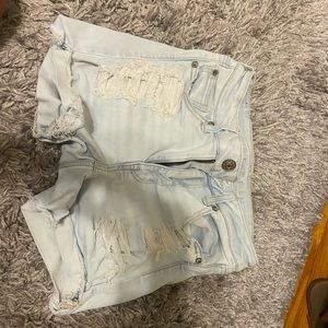 very light ripped jean shorts